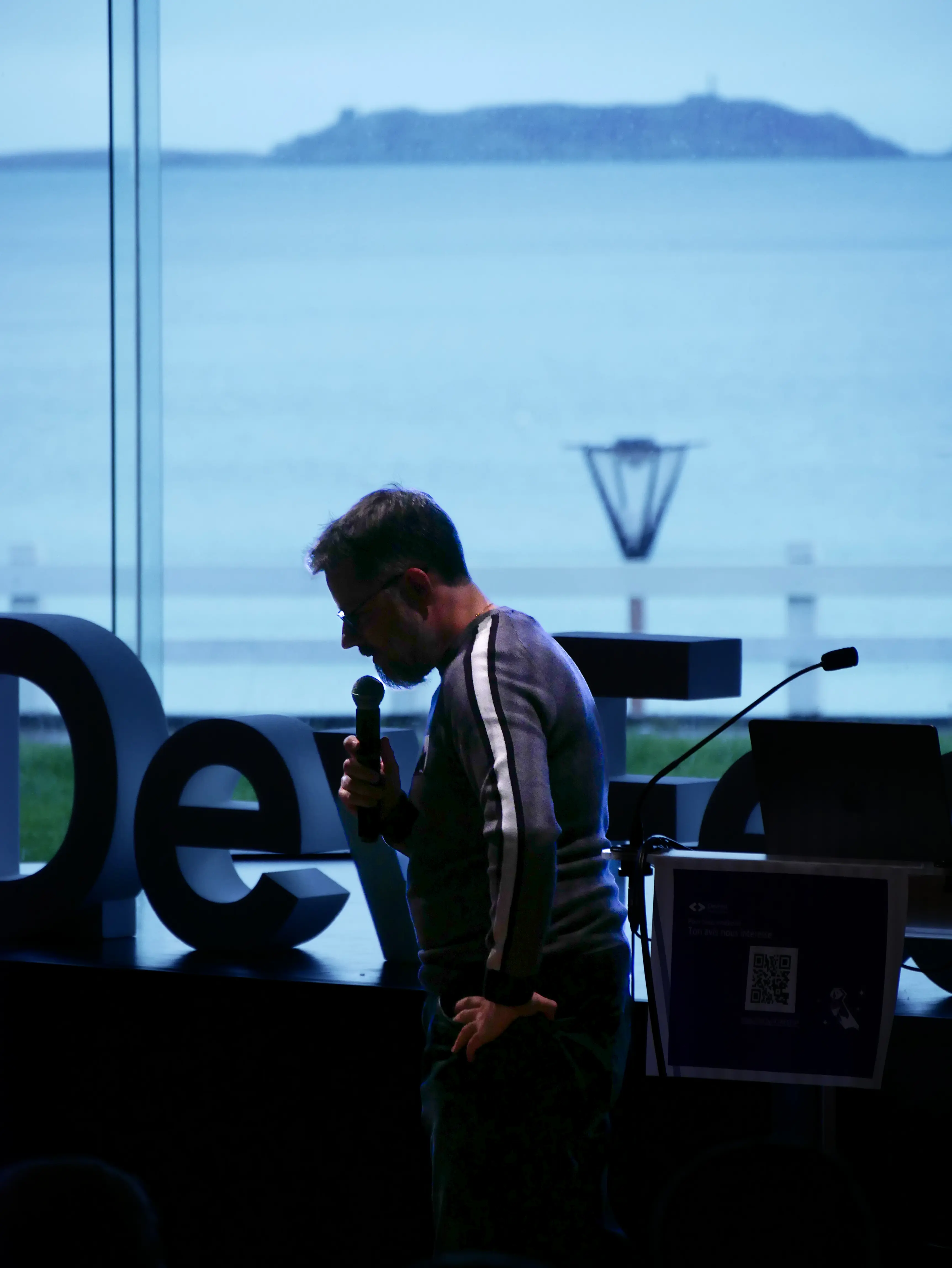 Speaker presenting at podium with microphone
