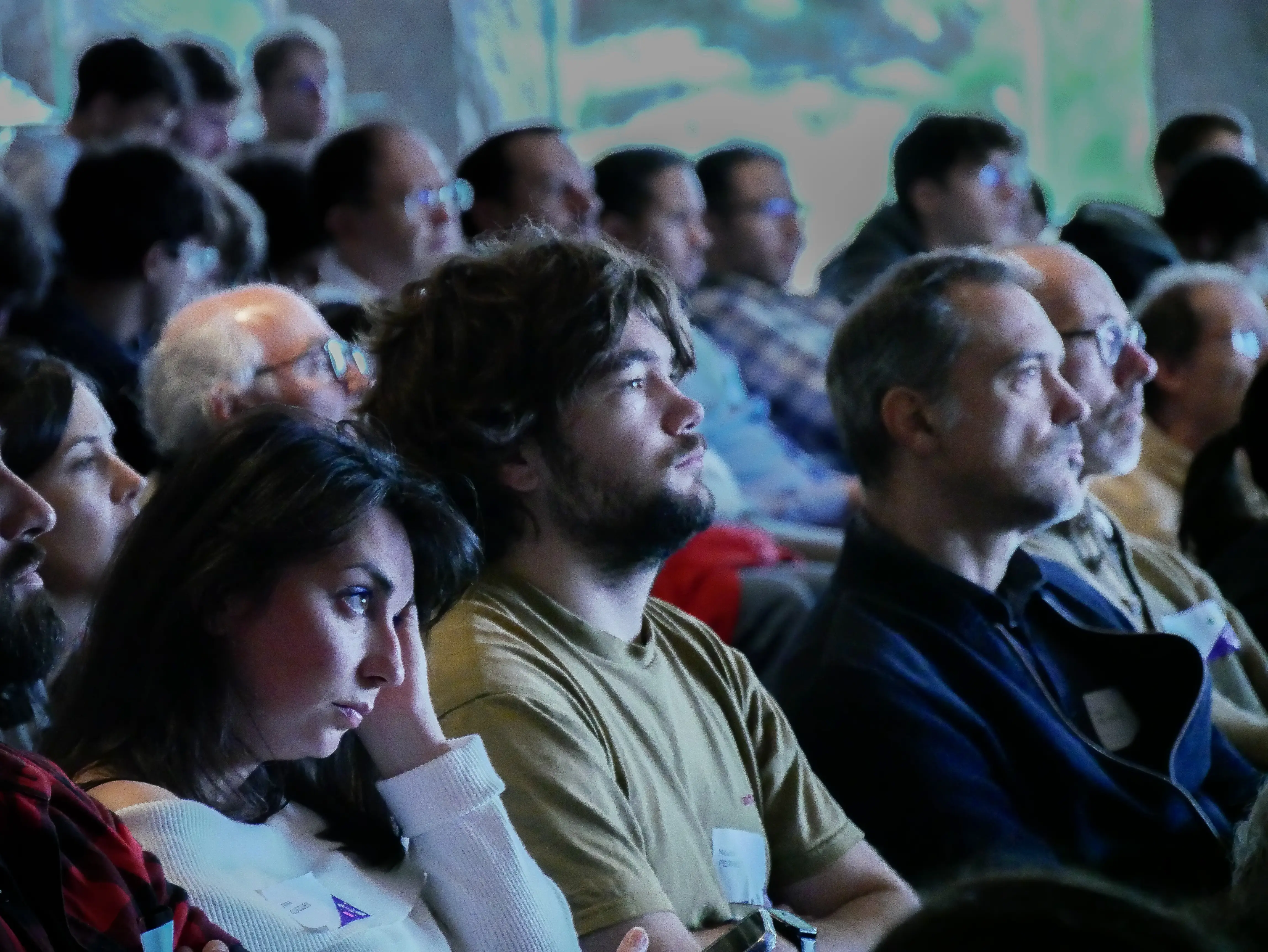 Audience watching a presentation attentively in the conference room
